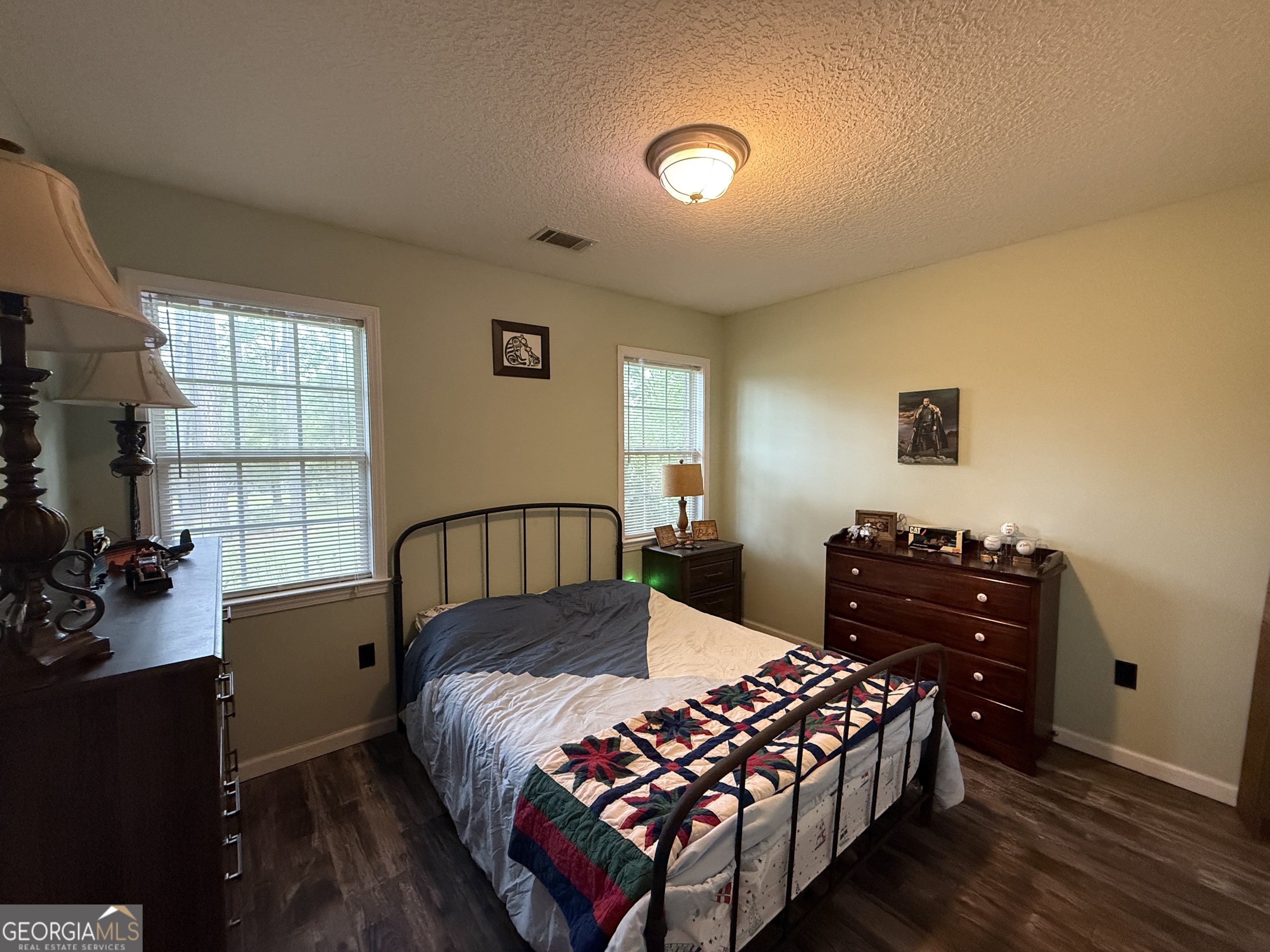26844 Highway 46 Metter, GA 30439 - Photo 25 of 36 a bedroom with a bed and wooden floor