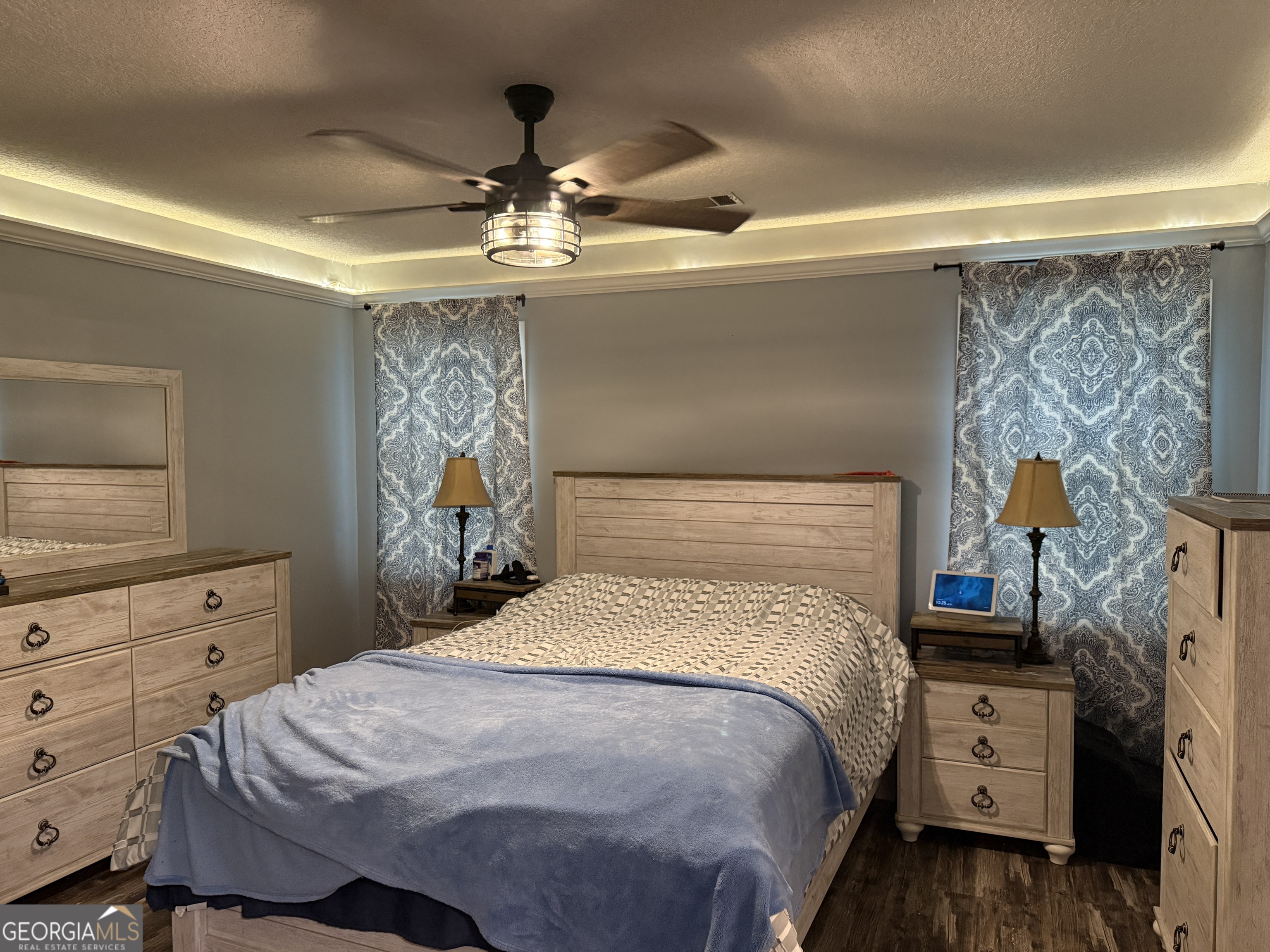 26844 Highway 46 Metter, GA 30439 - Photo 27 of 36 a bedroom with a bed and a flat tv screen on dresser