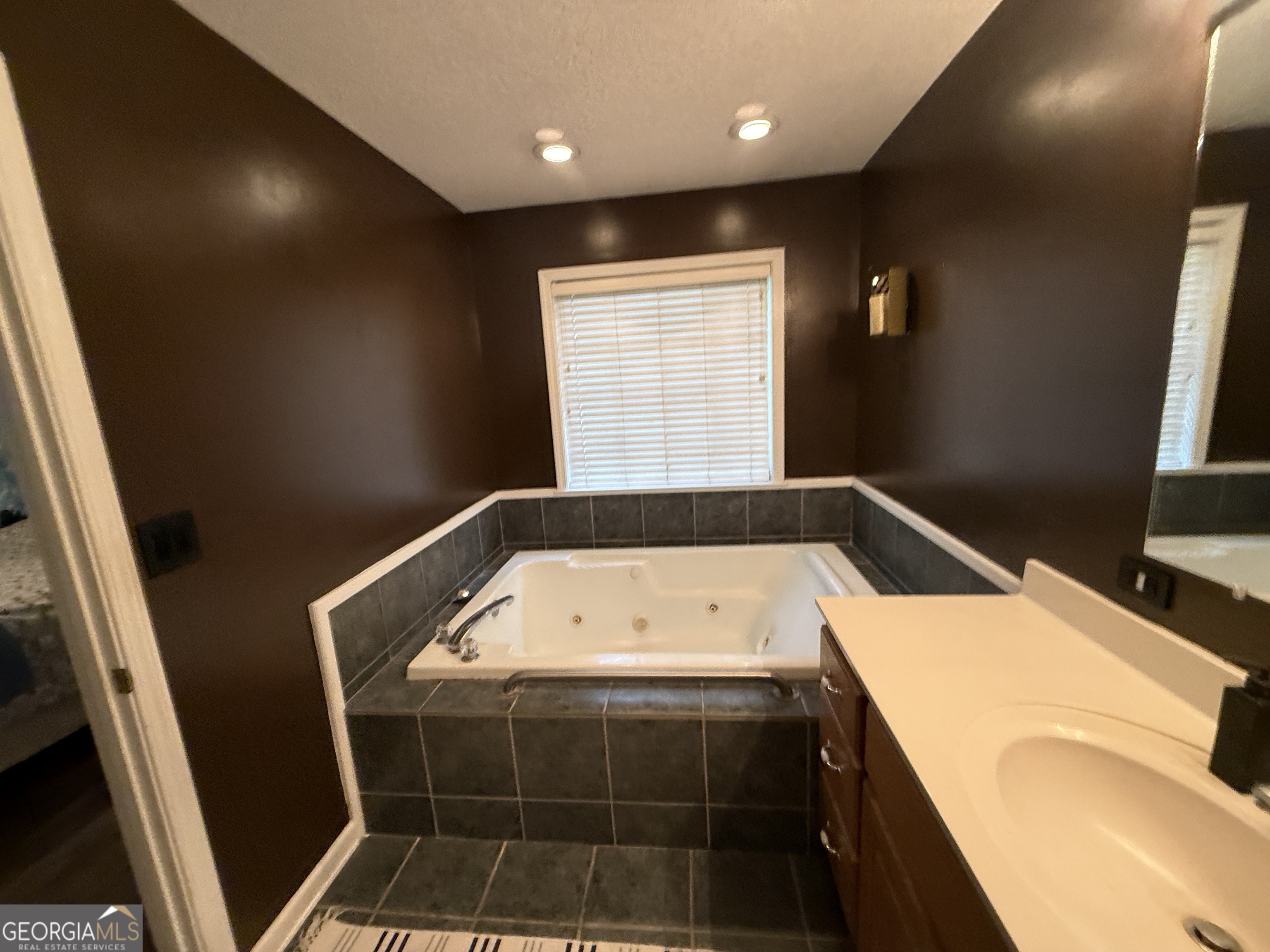 26844 Highway 46 Metter, GA 30439 - Photo 31 of 36 a bathroom with a bathtub and a window