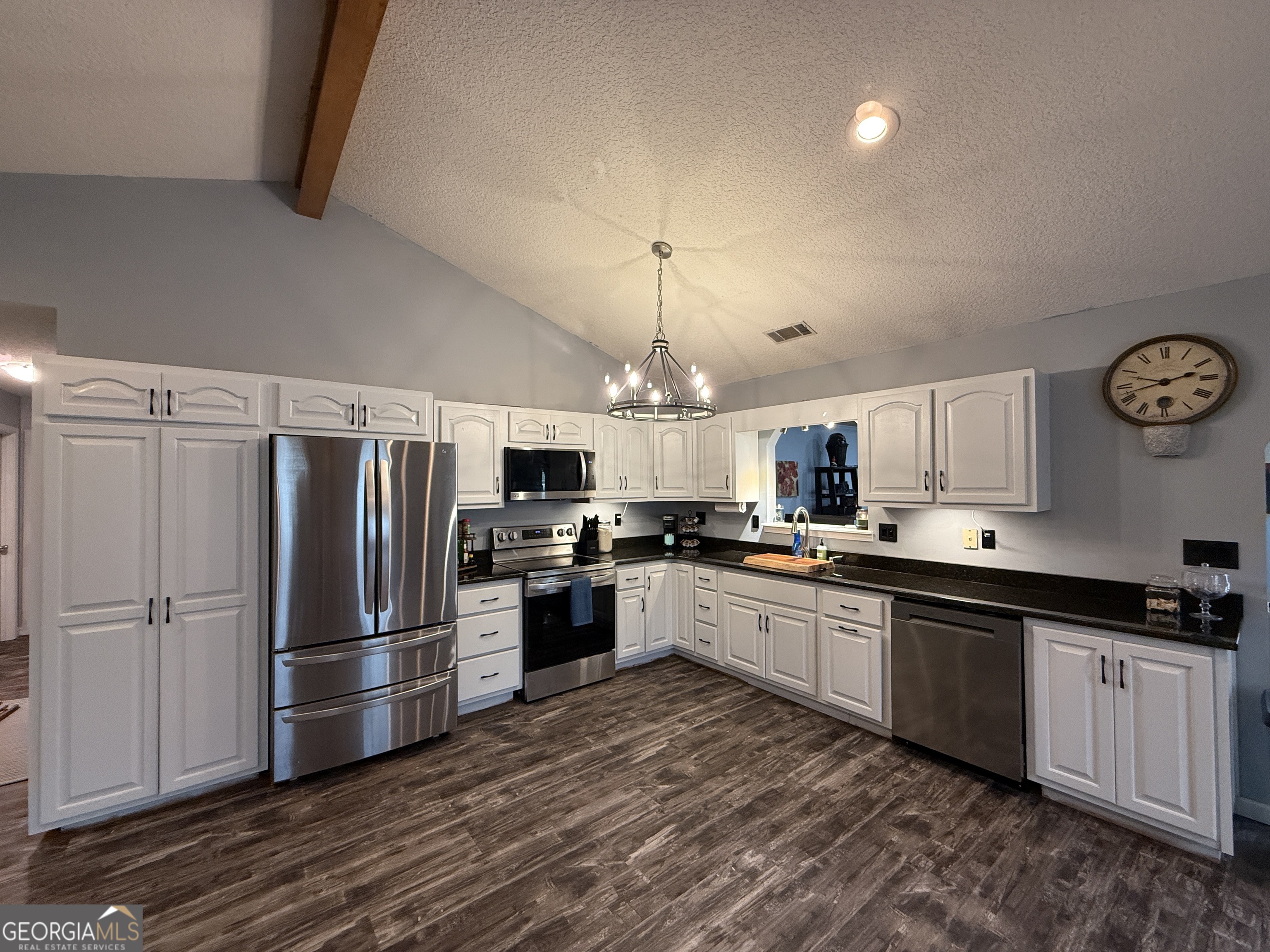 26844 Highway 46 Metter, GA 30439 - Photo 5 of 36 a kitchen with granite countertop a refrigerator stove top oven and sink