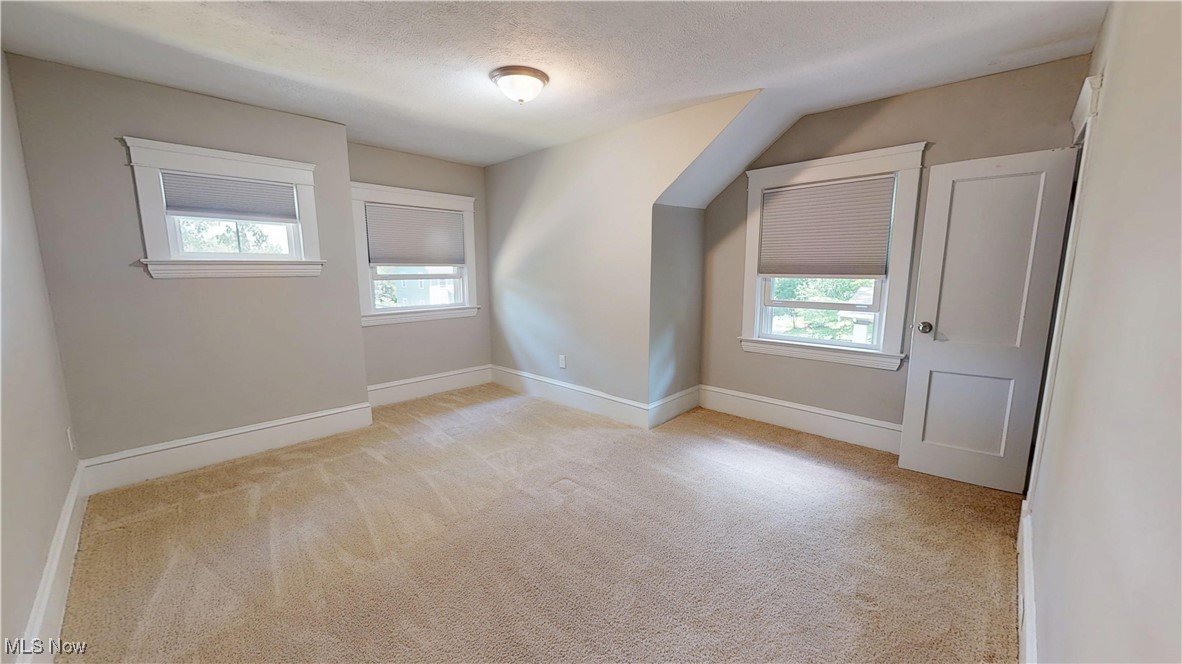 3174 Oak Road Cleveland, OH 44118 - Photo 20 of 33 Additional living space with carpet floors and a textured ceiling