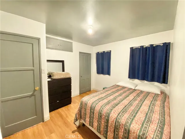 a bedroom with a bed and a closet