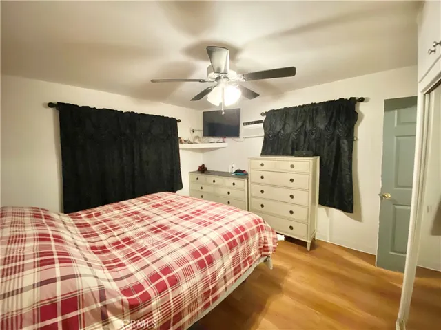 a bedroom with a bed and a closet