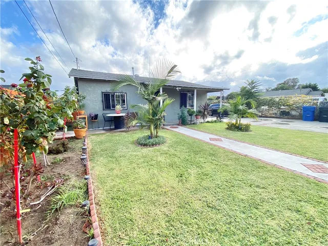 a front view of house with yard and seating area