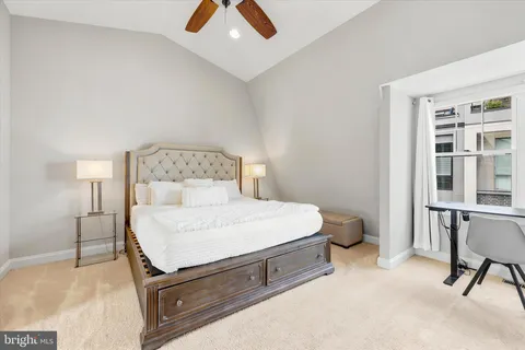 a bed room with a bed and a chair