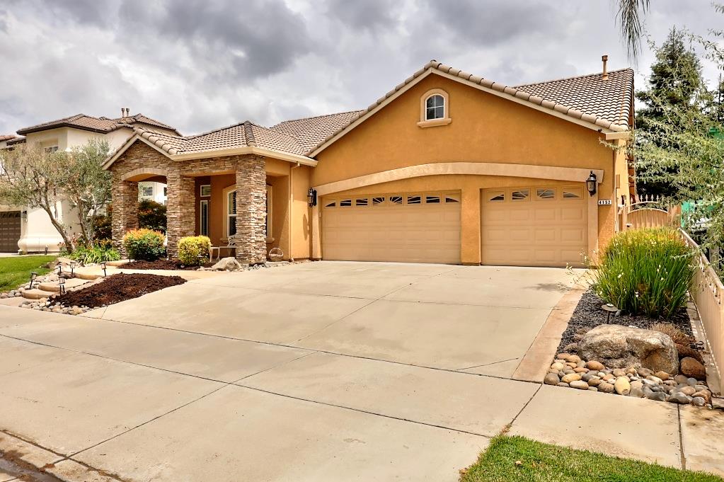 4152 Post Oak Drive Turlock, CA 95382 - Photo 3 of 71 a front view of a house with a yard