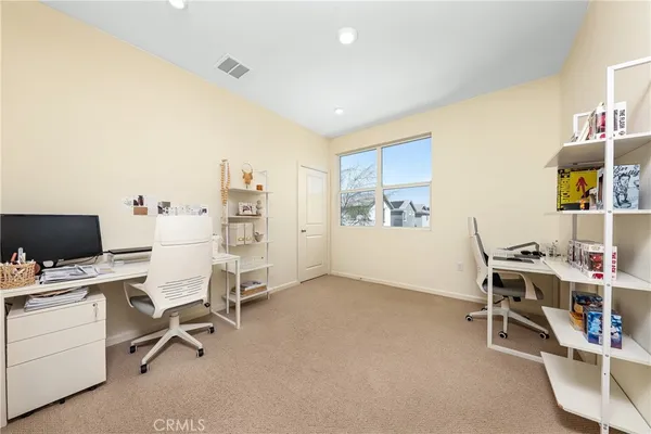 a view of a workspace with furniture