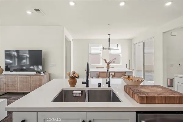 a spacious bedroom with a bed and a fireplace