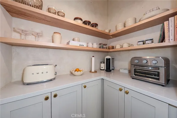 a view of a kitchen with appliances and cabinets