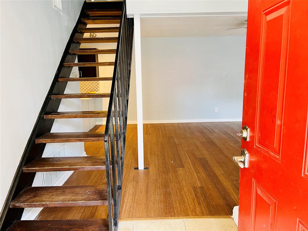 3121 Park Lane, Unit 1105 Dallas, TX 75220 - Photo 4 of 19 Stairs featuring wood finished floors and baseboards
