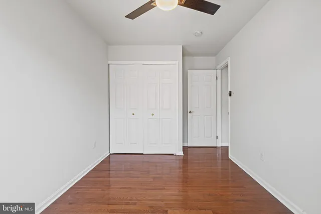 an empty room with wooden floor