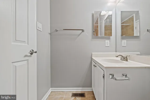 a bathroom with a sink and mirror