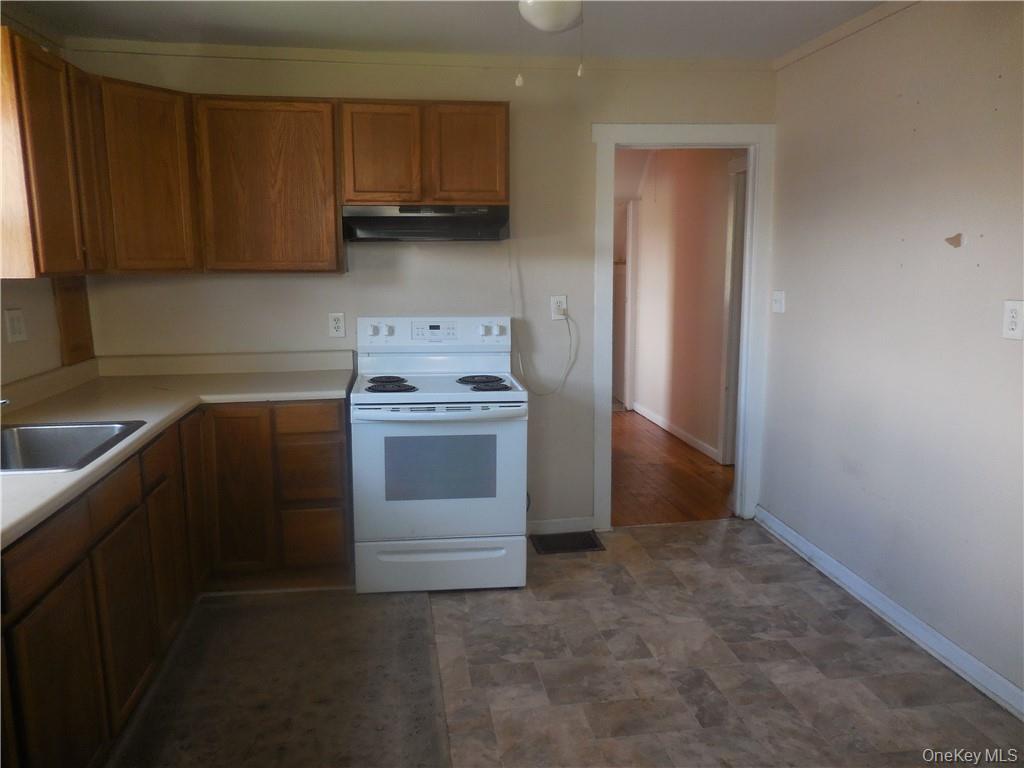 10 Edmunds Lane, Unit A Pine Bush, NY 12566 - Photo 6 of 23 a kitchen with a stove and a sink