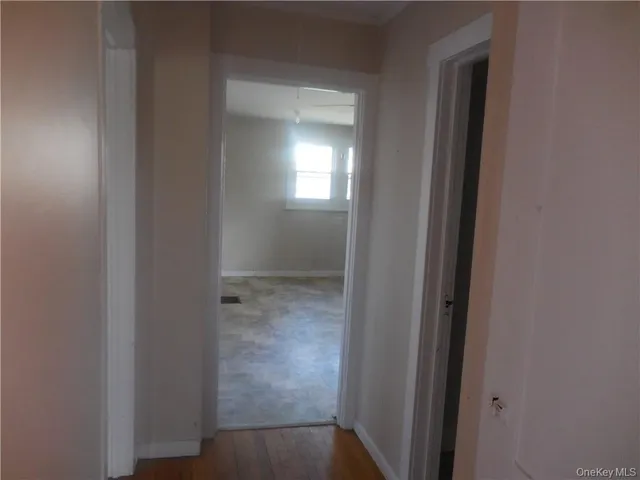 a view of a bathroom from a hallway