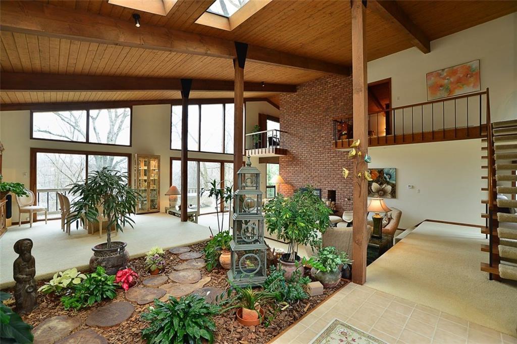 32 Club Road Carnegie, PA 15106 - Photo 6 of 24 Skylights open into a tranquil serenity garden with footpath in the entry.