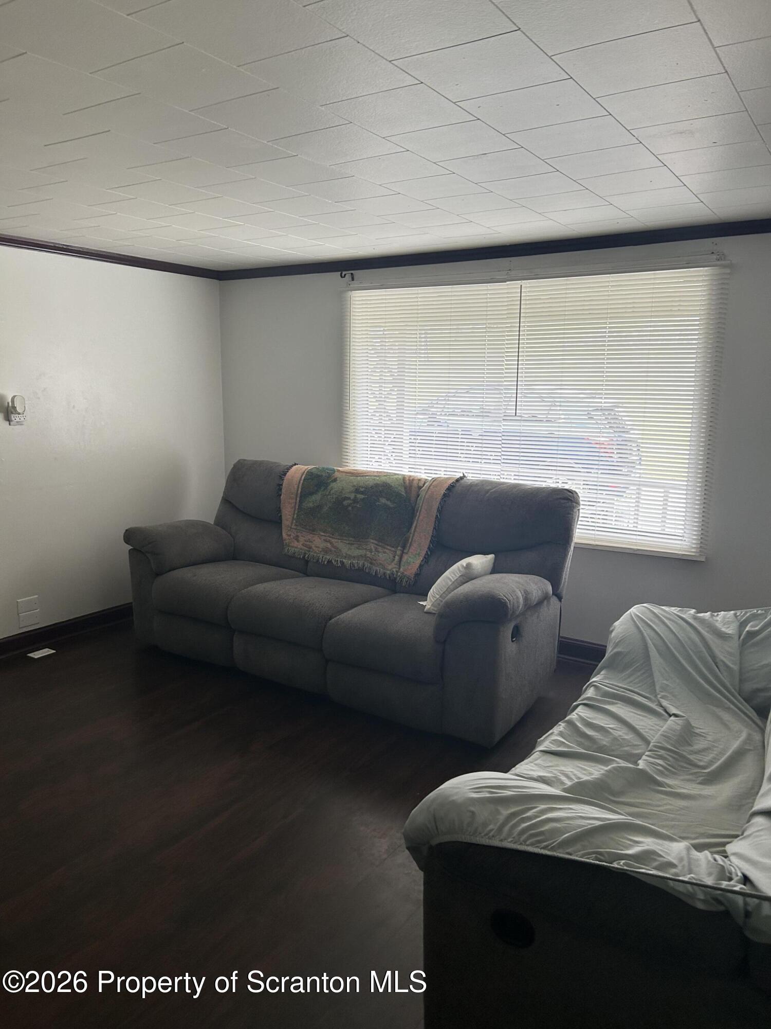 63 Shannon Street Simpson, PA 18407 - Photo 10 of 24 a living room with furniture and a window
