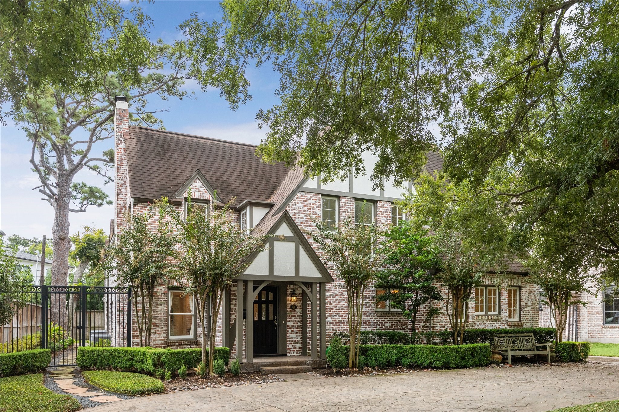 front view of a house with a tree