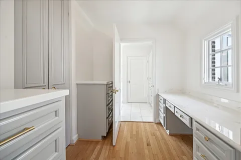 a kitchen with a refrigerator and a sink