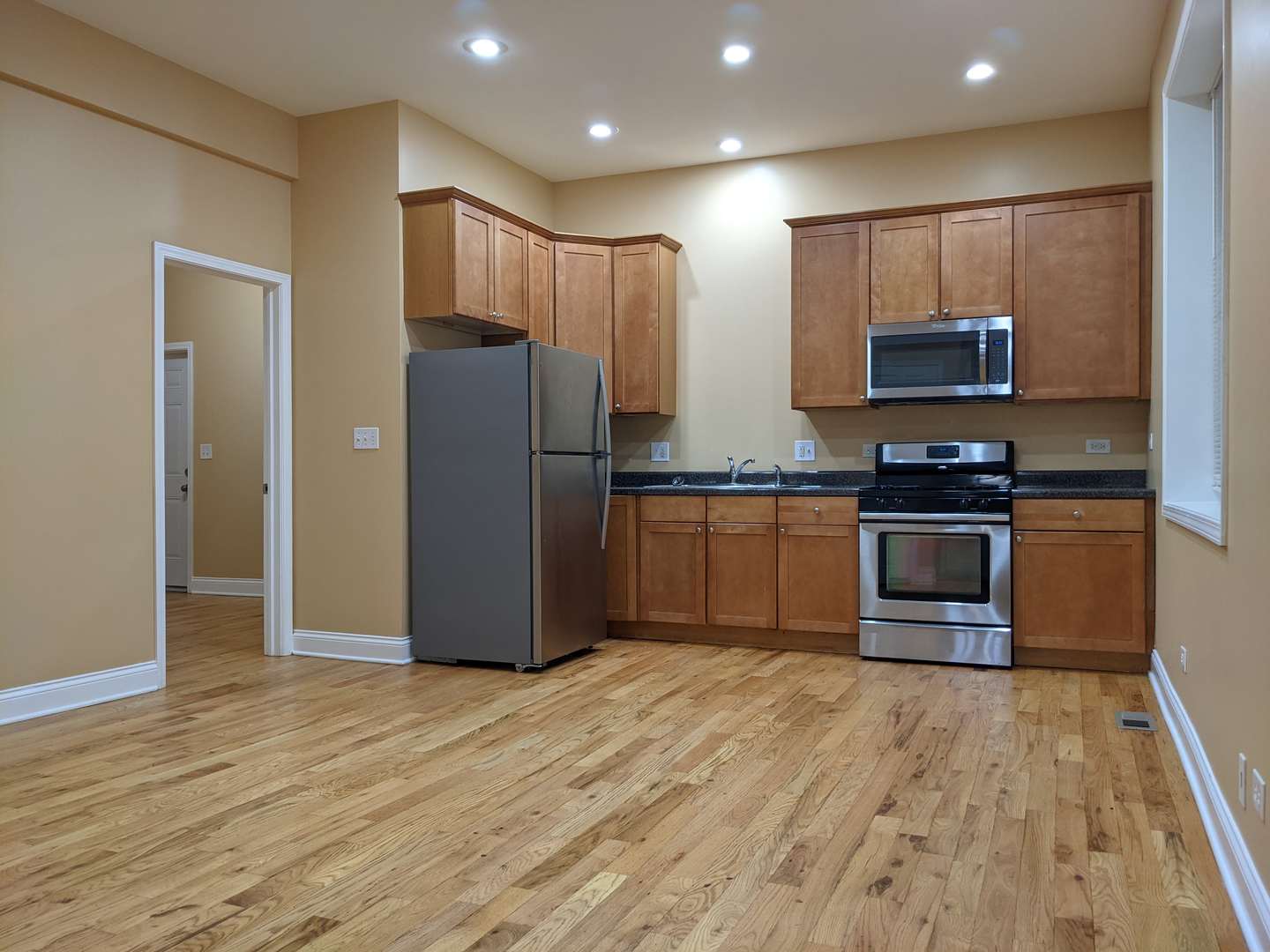 712 South Aberdeen Street, Unit 1A Chicago, IL 60607 - Photo 2 of 28 a kitchen with stainless steel appliances granite countertop a refrigerator and a stove