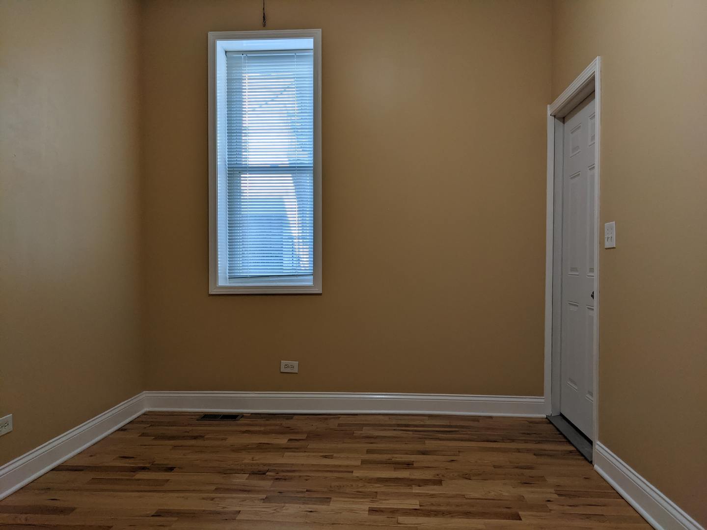 712 South Aberdeen Street, Unit 1A Chicago, IL 60607 - Photo 22 of 28 a view of a small space with wooden floor and a window