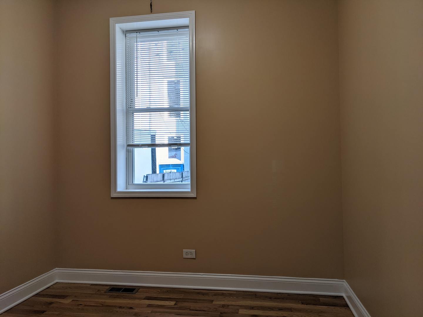 712 South Aberdeen Street, Unit 1A Chicago, IL 60607 - Photo 25 of 28 a view of a small space with wooden floor and a window