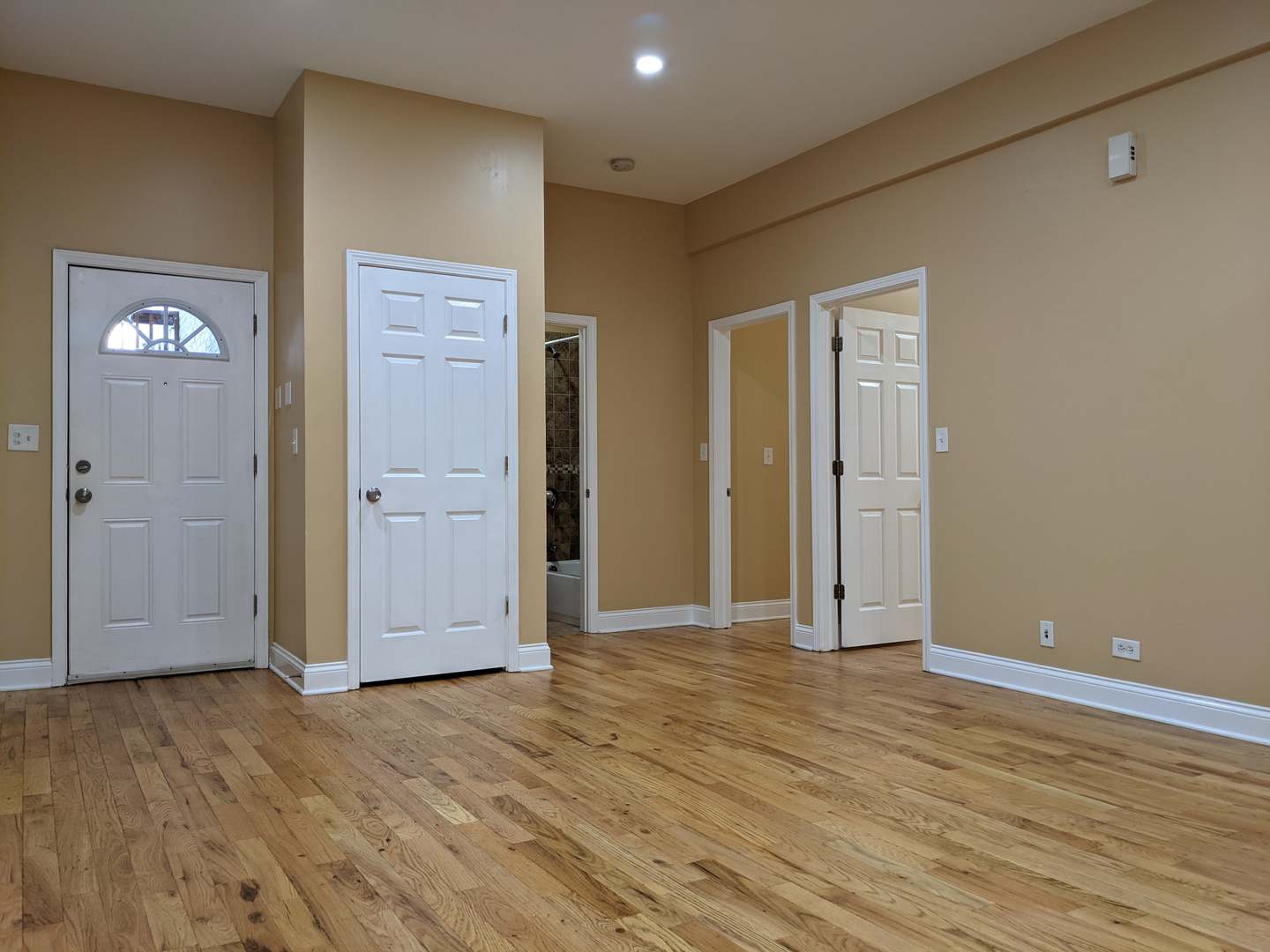712 South Aberdeen Street, Unit 1A Chicago, IL 60607 - Photo 4 of 28 a view of an empty room with wooden floor