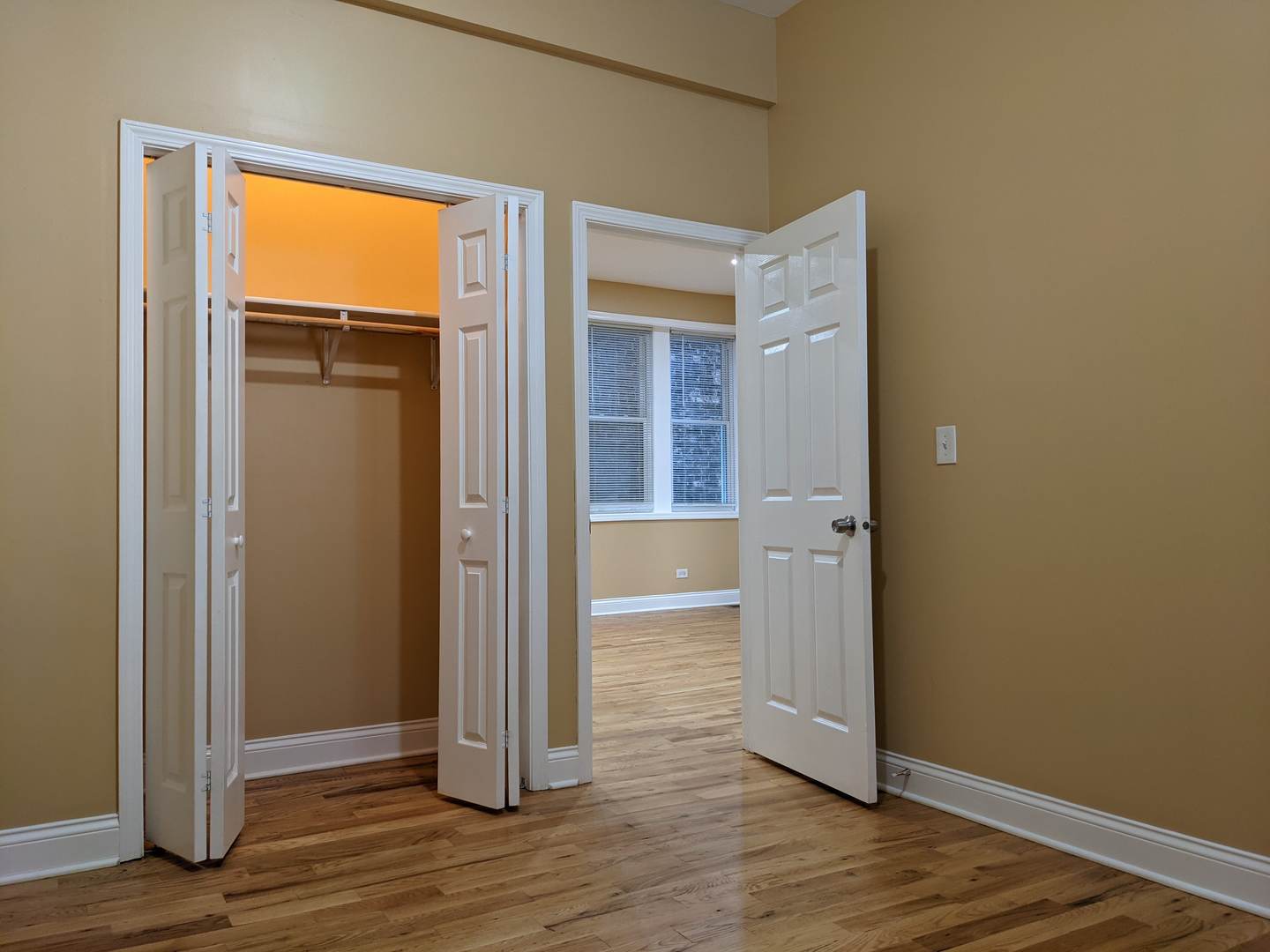 712 South Aberdeen Street, Unit 1A Chicago, IL 60607 - Photo 10 of 28 an empty room with wooden floor and a window