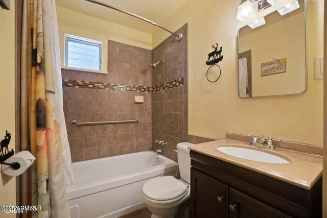 a bathroom with a sink a toilet and a bathtub