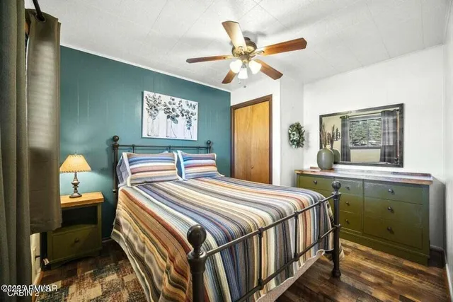 a bedroom with a bed and a window