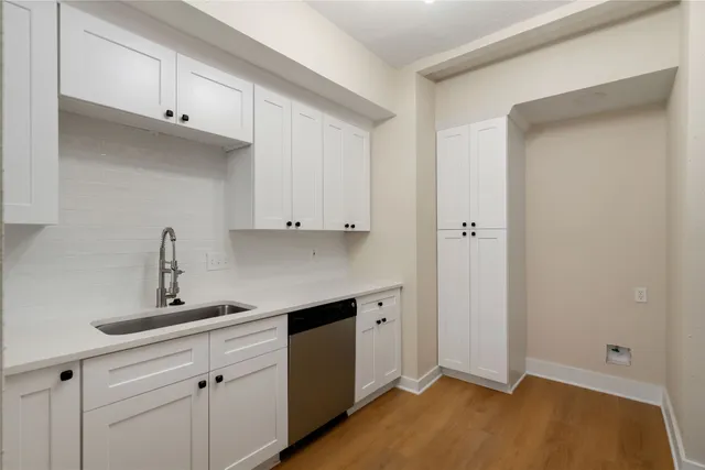 a kitchen with a sink and cabinets