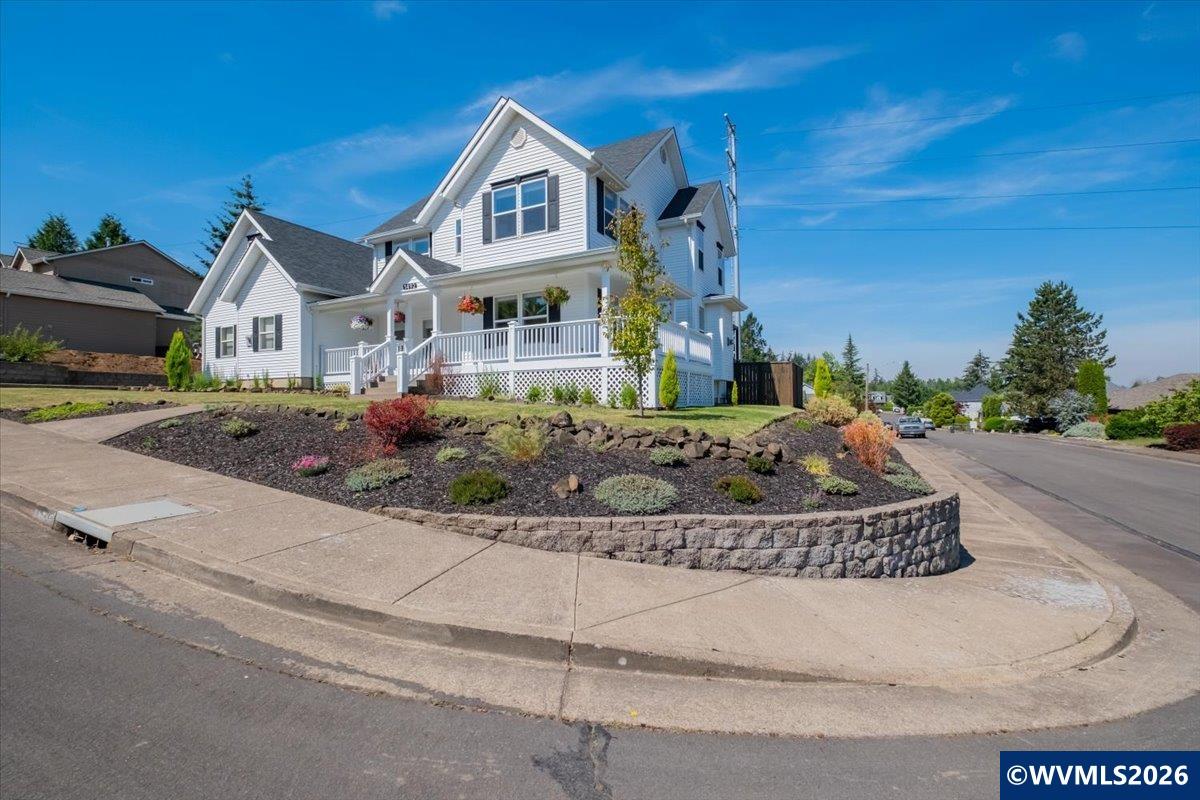 1492 Northwest Penny Lane Albany, OR 97321 - Photo 9 of 50 a front view of a house with a yard