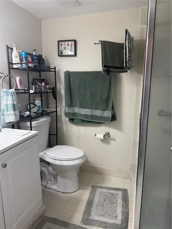 a view of a kitchen with a sink and refrigerator