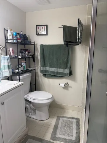 a view of a kitchen with a sink and refrigerator