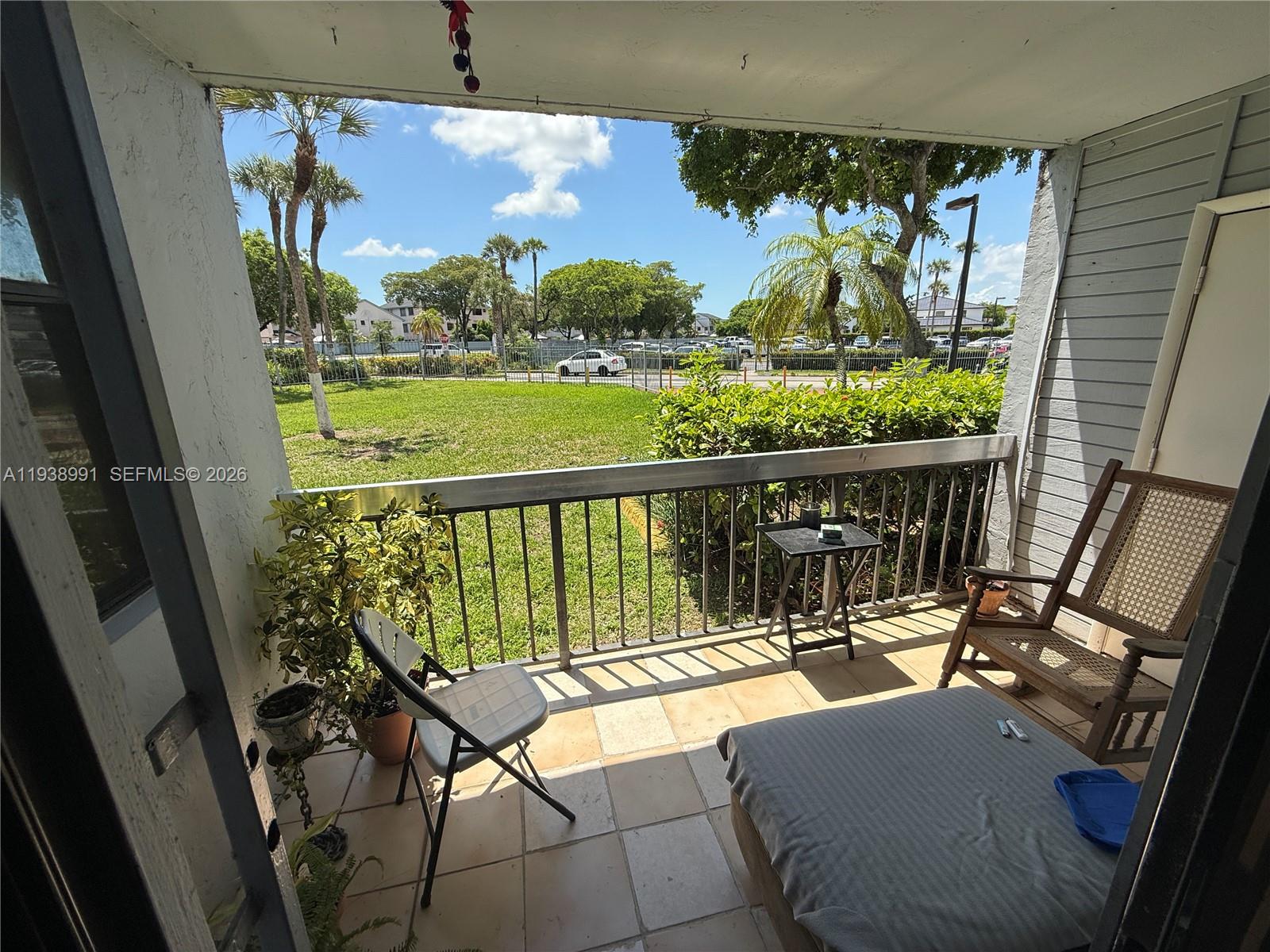 12209 Southwest 14th Lane, Unit 1101 Miami, FL 33184 - Photo 5 of 18 a view of balcony with furniture