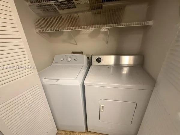 a bedroom with a bed and dresser