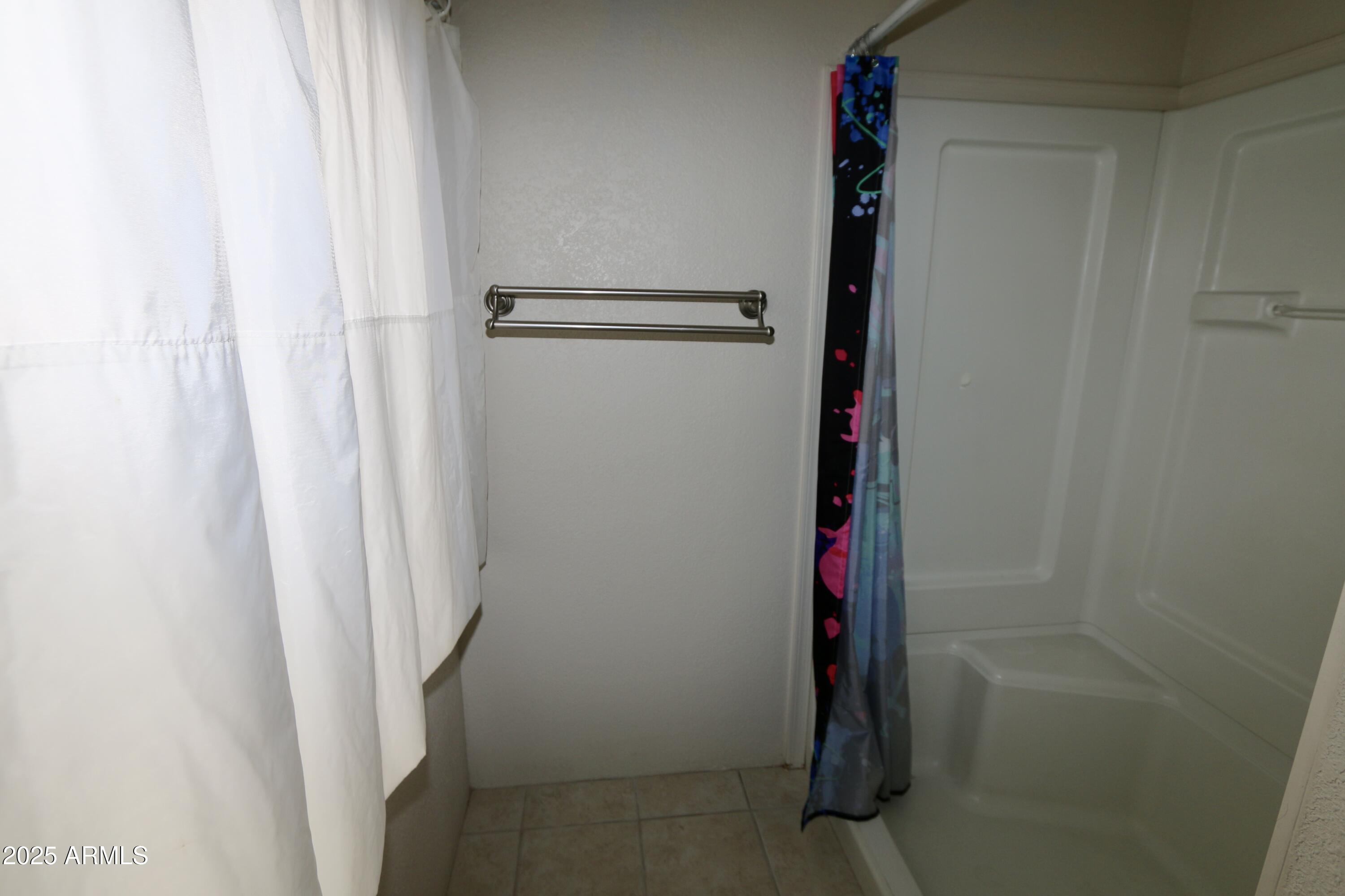 2701 East Utopia Road, Unit 208 Phoenix, AZ 85050 - Photo 15 of 22 a bathroom with a shower