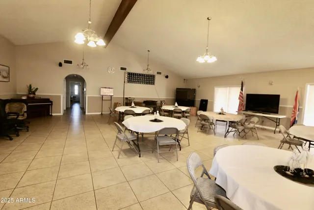 a living room with lots of furniture and a flat screen tv