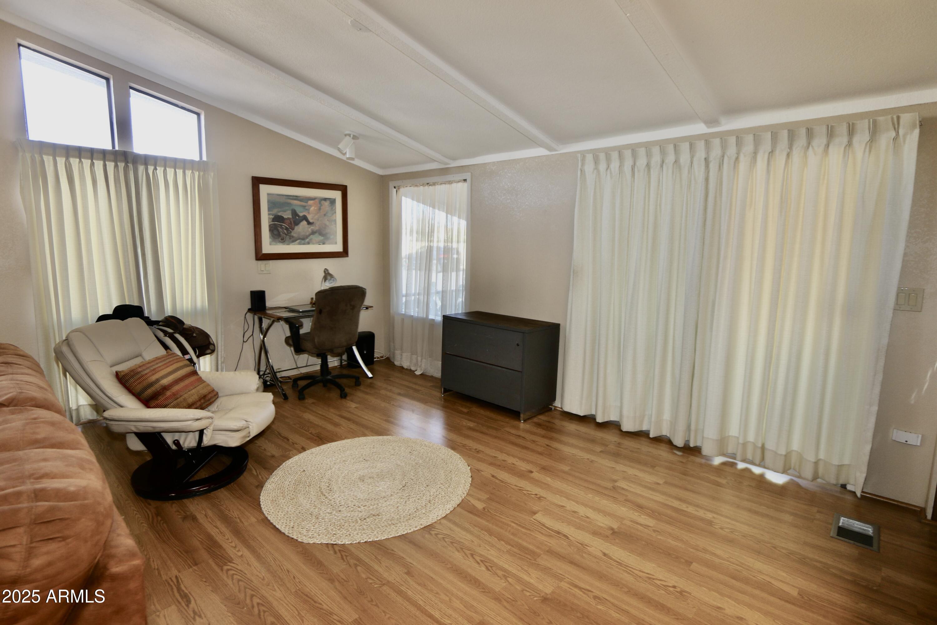 2701 East Utopia Road, Unit 208 Phoenix, AZ 85050 - Photo 5 of 22 a view of a workspace with furniture and a window