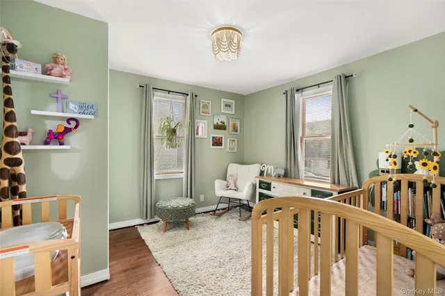 a bathroom with a sink vanity mirror and tub