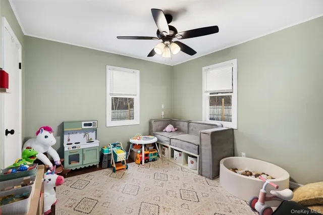a bedroom with furniture and a window