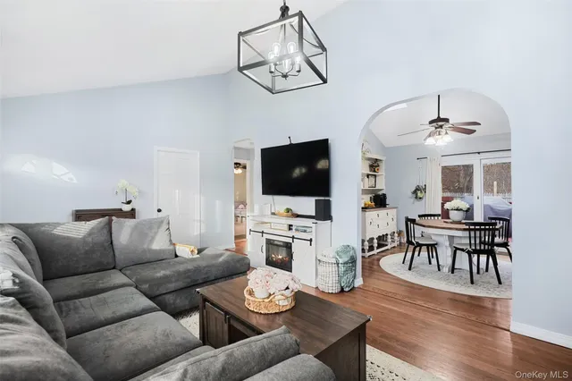 a view of a chairs and table on the water