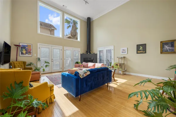 a living room with furniture fireplace and flat screen tv