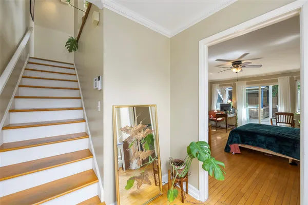 a view of entryway with furniture and wooden floor