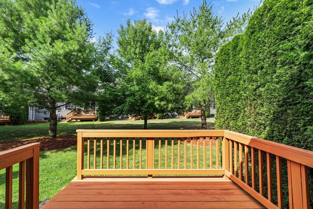 159 Allen Road, Unit 46 Billerica, MA 01821 - Photo 17 of 21 a view of balcony with wooden floor and fence
