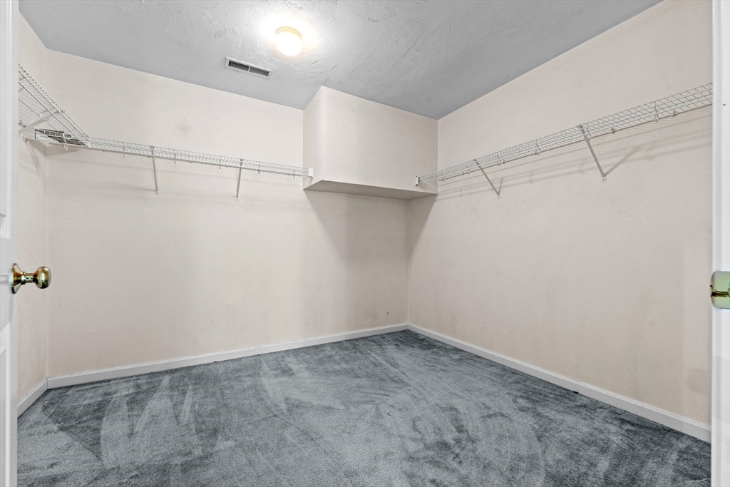 159 Allen Road, Unit 46 Billerica, MA 01821 - Photo 10 of 21 a view of a room with racks on the wall