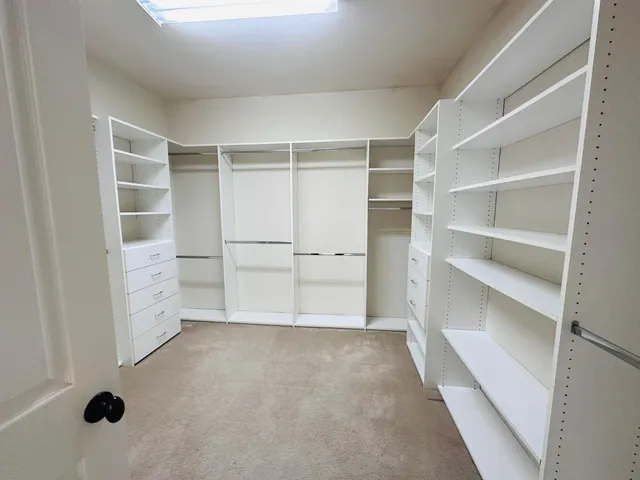 a view of an empty walk in closet