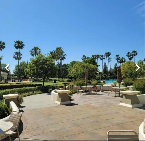 a view of a patio with swimming pool