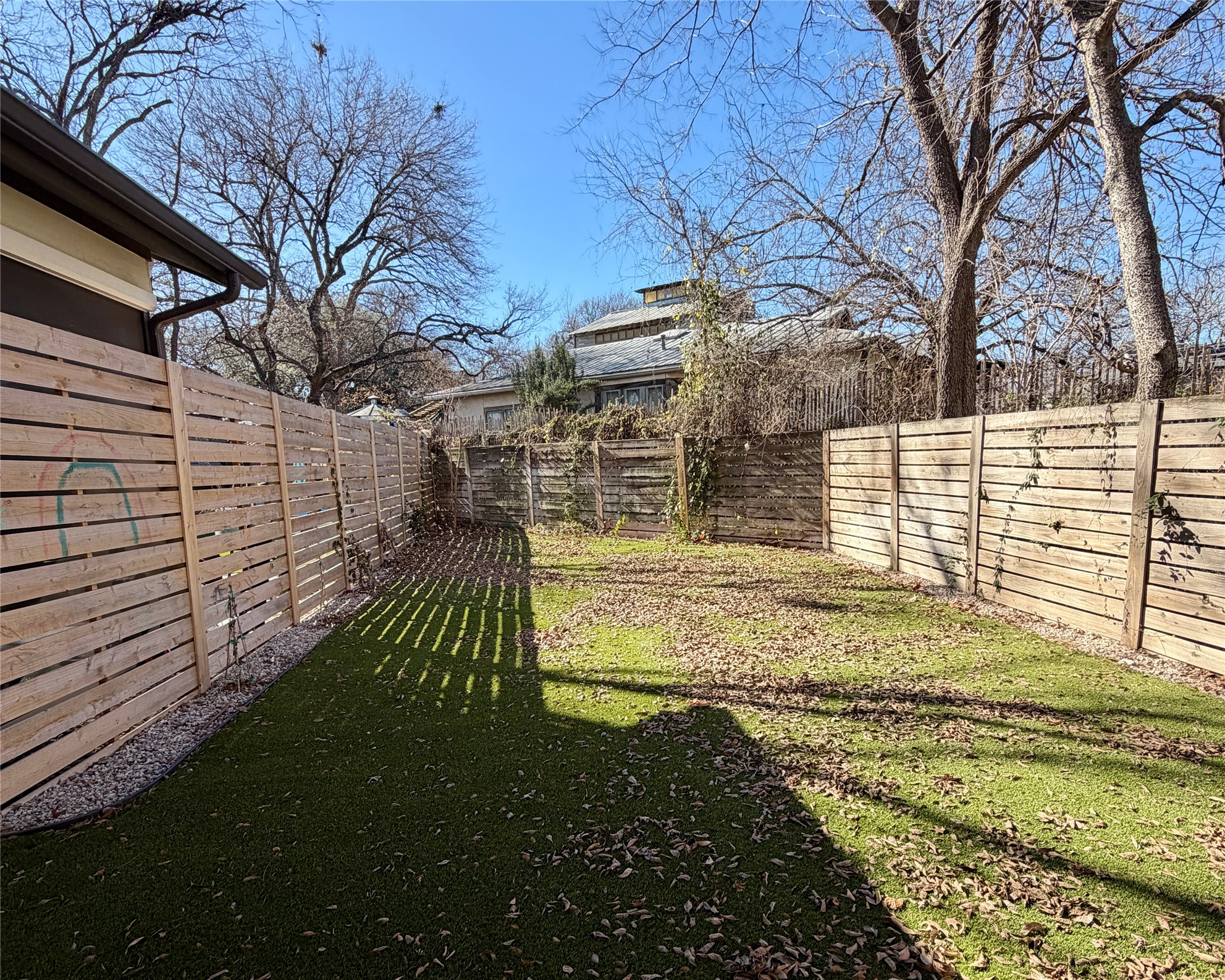 1515 Hether Street, Unit B Austin, TX 78704 - Photo 28 of 30 A private yard with new horizontal wood fencing, offering a serene outdoor retreat.