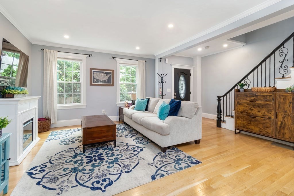 a living room with furniture and a rug