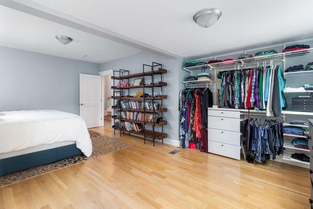 4 Goodwin Court Boston, MA 02127 - Photo 13 of 27 a view of walk in closet with clothes and shoes